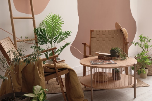 Harmonious Space with plants and wicker garden chairs, ladder