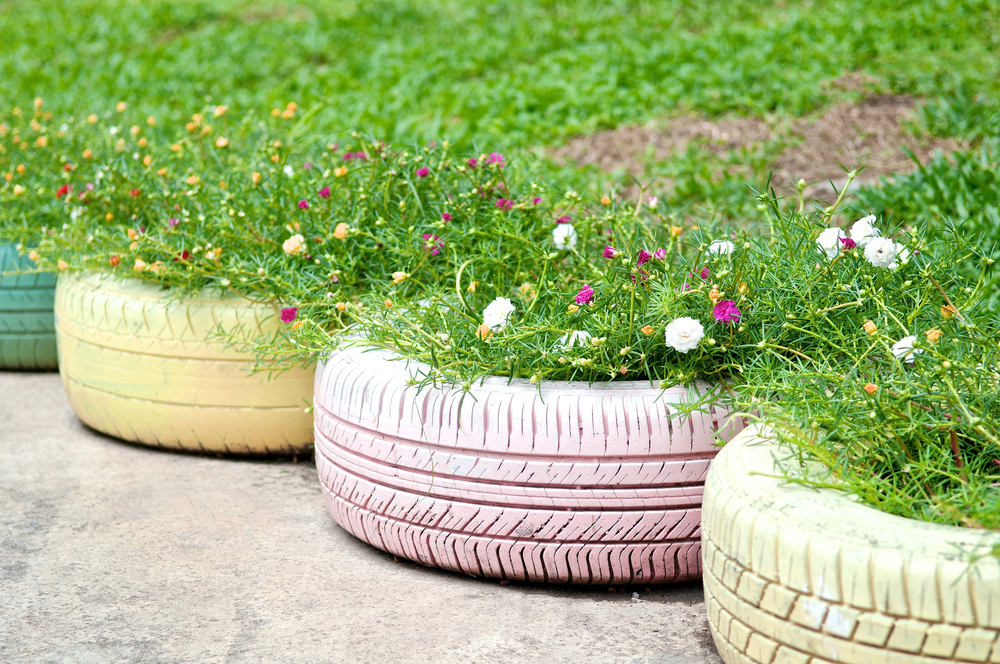 Pastel painted tires recycled as planters